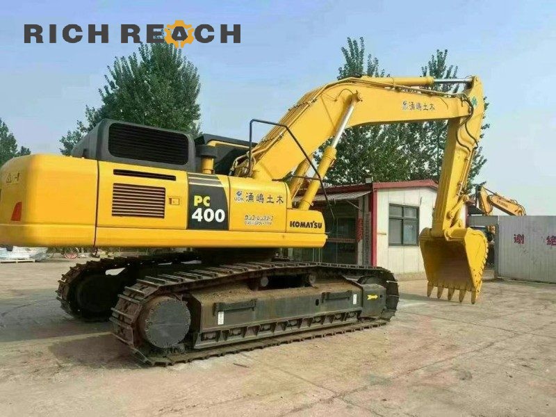 Side profile of a 2017 Komatsu PC400-8 excavator showing boom and arm, 2,300 hours, $45,833